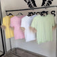 T shirt con piume